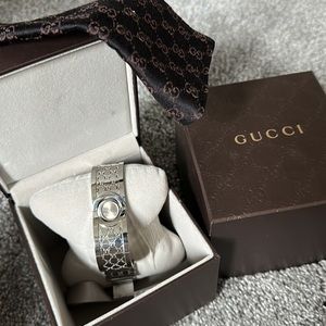 Authentic Gucci Cuff Watch. Barely worn, no scuffs or damage.